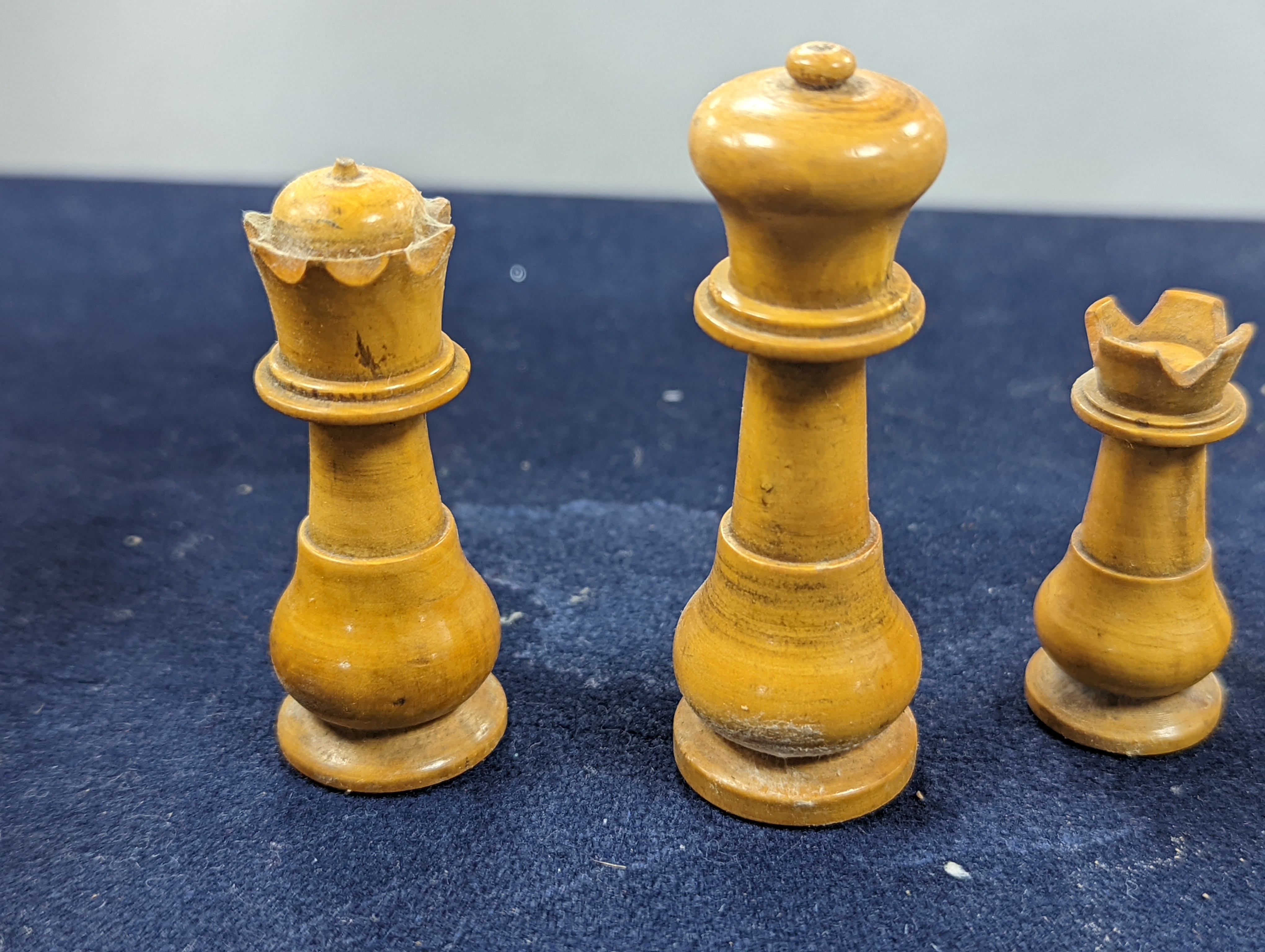 A Victorian brass inset mahogany games box, fitted with solitaire, cribbage, chessmen, draughts etc., 33cm, a turned and stained bone chess set, another games box containing chessmen and draughts